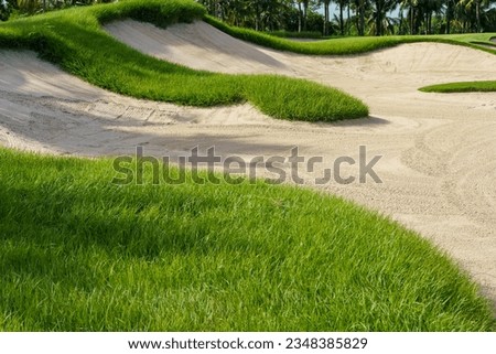 Golf course sand pit bunker aesthetic background,Used as obstacles for golf competitions for difficulty and falling off the course for beauty. Royalty-Free Stock Photo #2348385829