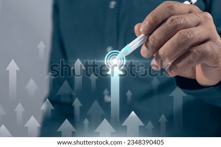 Businessman analyzing company financial balance sheet working with digital virtual graphics Businessman calculating financial data for long-term investment growth goals marketing planning goals Royalty-Free Stock Photo #2348390405