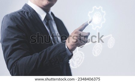 Businessman hand drawing gear icon on virtual screen. Business and technology concept.