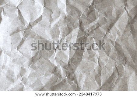 Light grey crumpled paper background. Horizontal crumpled light grey paper.
