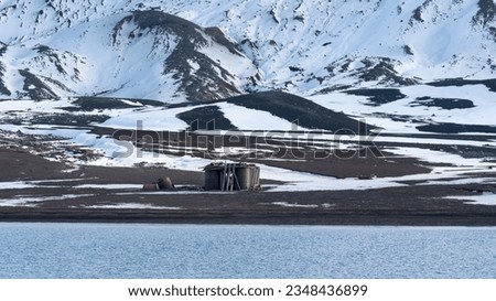 Abandoned norwegian whale hunter station rusty blubber tanks. High quality photo