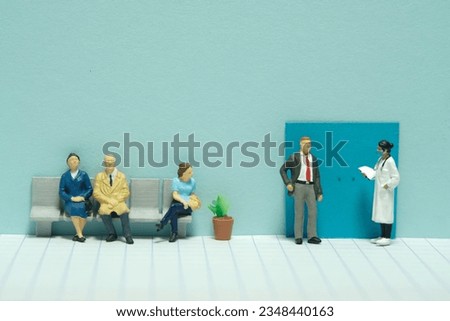 Miniature tiny people toy figure photography. A waiting line in hospital of patient to meet the doctor for medical health check. Image photo