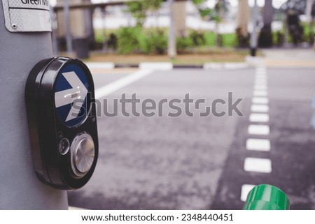 Crosswalk Pedestrian Signal Button and Sign push button in Singapore.