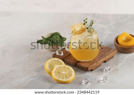 Lemon peach mojito. Summer cold iced cocktail recipe, with fresh peach, lemon and basil leaves.