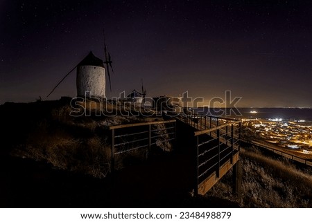 Long exposure night photographs of the Consuegra mills in Toledo Spain
