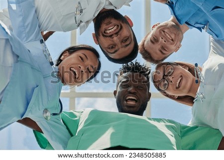 Portrait of a group of happy doctors and nurses in hospital
