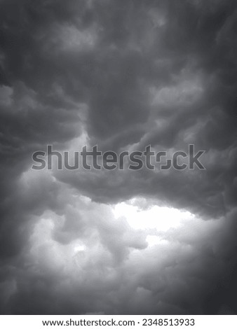 This is a picture of black stormy clouds before raining. In this picture you can the horror black clouds and stormy clouds.
