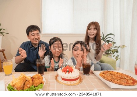 Young family with twins, birthday party image