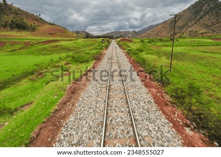 Route of the train tracks between Cusco and Machu Picchu, in the background the Andes. Royalty-Free Stock Photo #2348555027