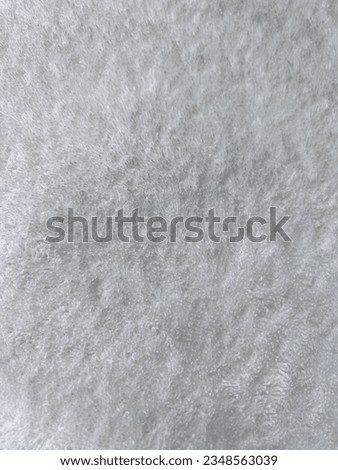 Gray fluffy textile surface, fur fabric. Grey fur. Abstract fabric background. Gray warm cloth concept for background. Fluffy texture. Grey carpet texture. High quality photos. Royalty-Free Stock Photo #2348563039
