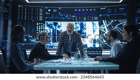 Senior Chief Software Engineer Showing a Satellite Tracking Technology Capabilities to a Group of High Profile Government and Cybersecurity Officials. Colleagues Discussing New GPS Software Royalty-Free Stock Photo #2348564643