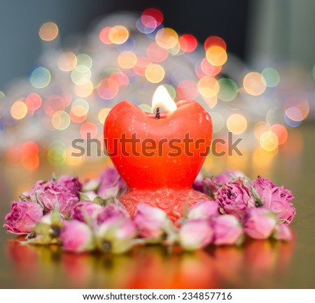 Valentine composition with roses and heart candle on abstract background