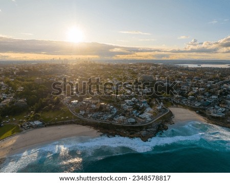 defaultDrone aerial point of view cityscape skyline skyscrapers and village community people house by ocean coastline beach at NSW, Australia at sunrise. Landmark famous place and beauty nature concep