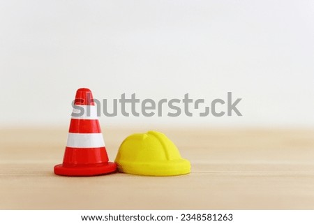 Traffic cone and helmet. Concept of construction and safety
