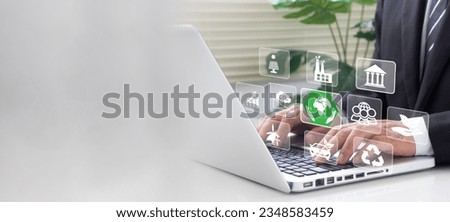 Businessman analyze sustainability investment with icons of ESG. Concept of ESG environment social governance, Net zero, Green energy, Carbon neutral, Green technology, and Carbon credit.Copy space.  Royalty-Free Stock Photo #2348583459