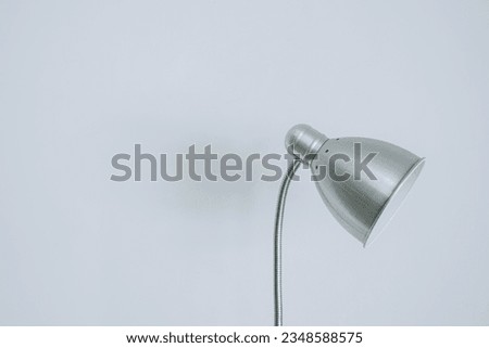 Vintage and modern metal desk lamp on isolated white background