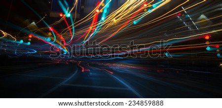 Traffic lights and cars, long exposure in motion Royalty-Free Stock Photo #234859888