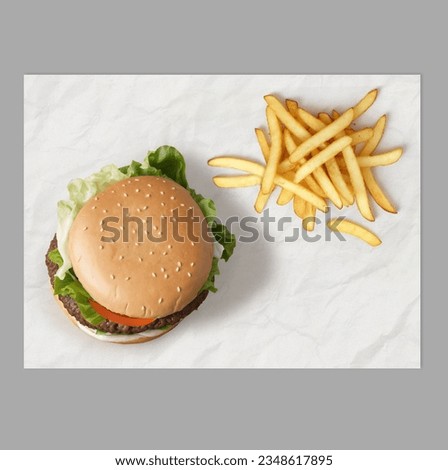Mockup for fast food branding design, top-view wrapping paper placemat. Hamburger and fries placed on your custom-branded wrapping paper.  Royalty-Free Stock Photo #2348617895