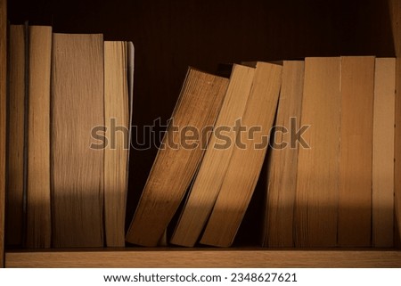 some old books on the bookshelf in a library
