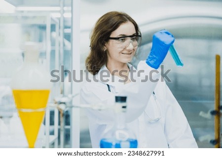 science technology chemist developing concept, female researcher, medical scientist or doctor or student is looking in a microscope in Modern Laboratory