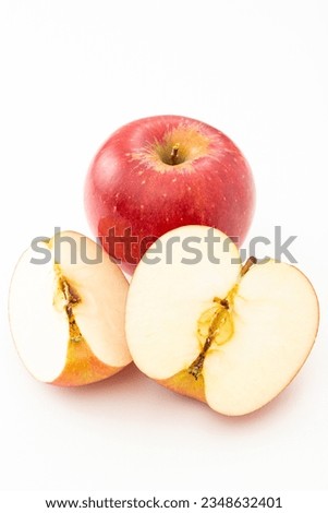 A cut apple on a white background.
