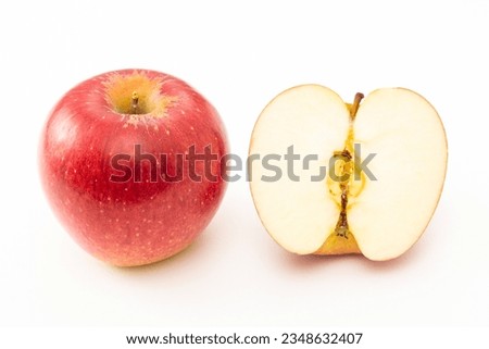 A cut apple on a white background.