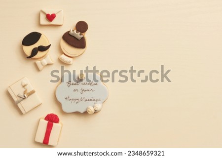 self-made clay cookies of bride and groom