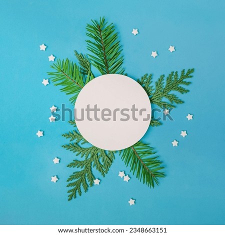 Christmas template, blank paper circle and small brunches and sugar stars, place for text