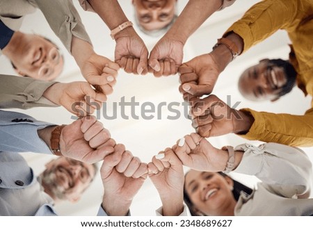 Team building, fist bump and business people portrait in office for teamwork, support or faith from below. Diversity, hands and team face together sign for union, trust and partnership or motivation Royalty-Free Stock Photo #2348689627