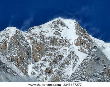 the snowy peak of Mont Blanc in the Italian Alps seen from Punta Hellbronner in July 2023 Royalty-Free Stock Photo #2348697277