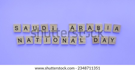 September 23, Saudi Arabia National Day, a minimalistic banner with the inscription in wooden letters on a blue background