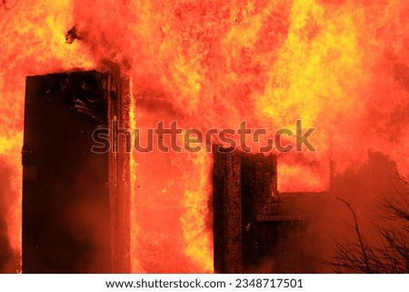 House on fire on a dark wintermorning
