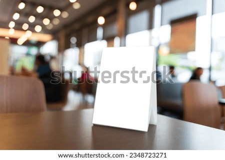 Menu mock up blank for text marketing promotion. Mock up Menu frame standing on wood table in restaurant space for text