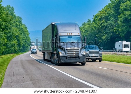 Horizontal shot of Tennessee interstate traffic on a summer morning. Royalty-Free Stock Photo #2348741807