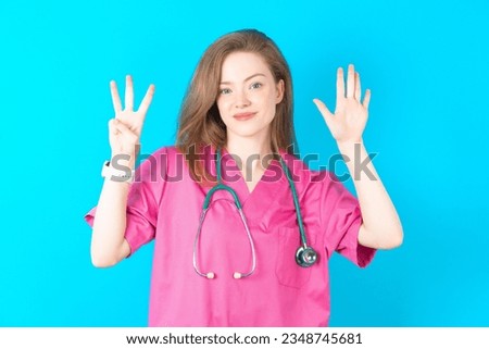 Young caucasian doctor woman wearing medical uniform showing and pointing up with fingers number eight while smiling confident and happy.