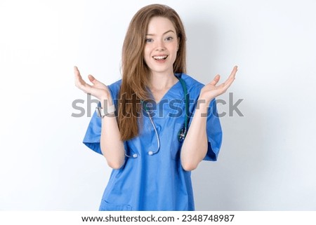 Surprised terrified Young caucasian doctor woman wearing medical uniform Gestures with uncertainty, stares at camera, puzzled as doesn't know answer on tricky question, People, body language, emotions