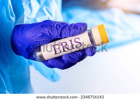 New infectious Eris variant of covid disease (EG.5) sample in lab tube in the scientist hand in blue medical glove on light background Royalty-Free Stock Photo #2348756143