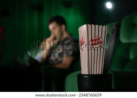 Cinema concept. People watching movie at cinema eating popcorn