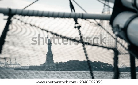 statue of liberty in over cloudy sky