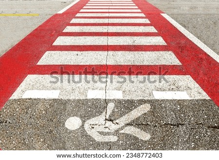 crosswalk with human symbol on the road