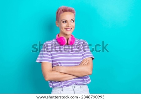Portrait of lovely positive person crossed arms headphones hang neck look empty space isolated on turquoise color background Royalty-Free Stock Photo #2348790995