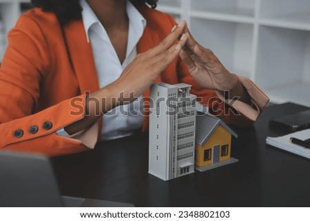 Real estate agent and customer signing contract to buy house, insurance or loan real estate.rent a house,get insurance or loan real estate or property. Royalty-Free Stock Photo #2348802103