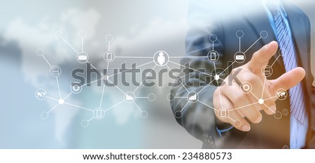 hand pushing social network button on a touch screen interface


