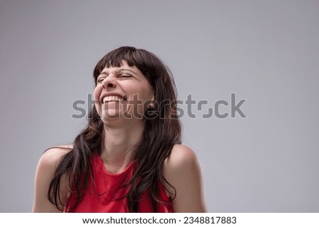 Woman showing strong derision with hints of contempt. Not merely laughing, but mocking others with malice. Delights in others' misfortune, deeming them inferior Royalty-Free Stock Photo #2348817883