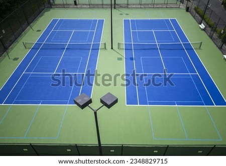 Drone view of just painted blue and green Pickleball tennis courts from above. Royalty-Free Stock Photo #2348829715