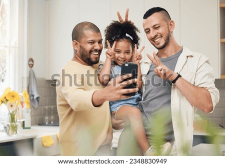 Selfie, blended family and a happy girl with her gay parents in the kitchen together for a profile picture. Adoption photograph, smile or love and a playful daughter with her lgbt father in the home Royalty-Free Stock Photo #2348830949