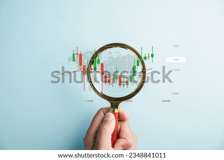 In hands ofskilled trader,magnifier glass becomestool for discovery and analysis, unveiling potential of stock market's bar graph for business investments. Technical price graph and indicator Royalty-Free Stock Photo #2348841011