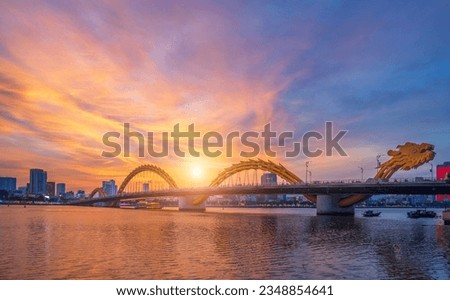 Dragon Bridge and traffic in Da Nang Vietnam. And beautiful sunset sky. Royalty-Free Stock Photo #2348854641