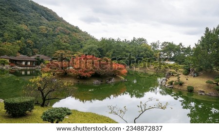 Ancient Japanese garden with a lake in Tokyo Japan. High quality photo
