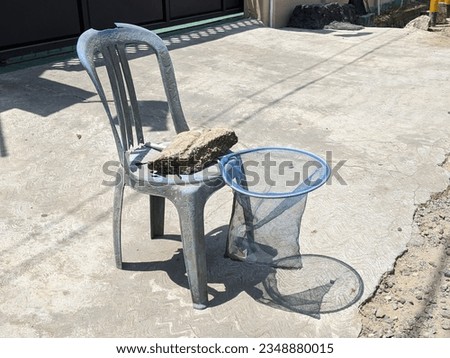 net on the chair for collect money beside road